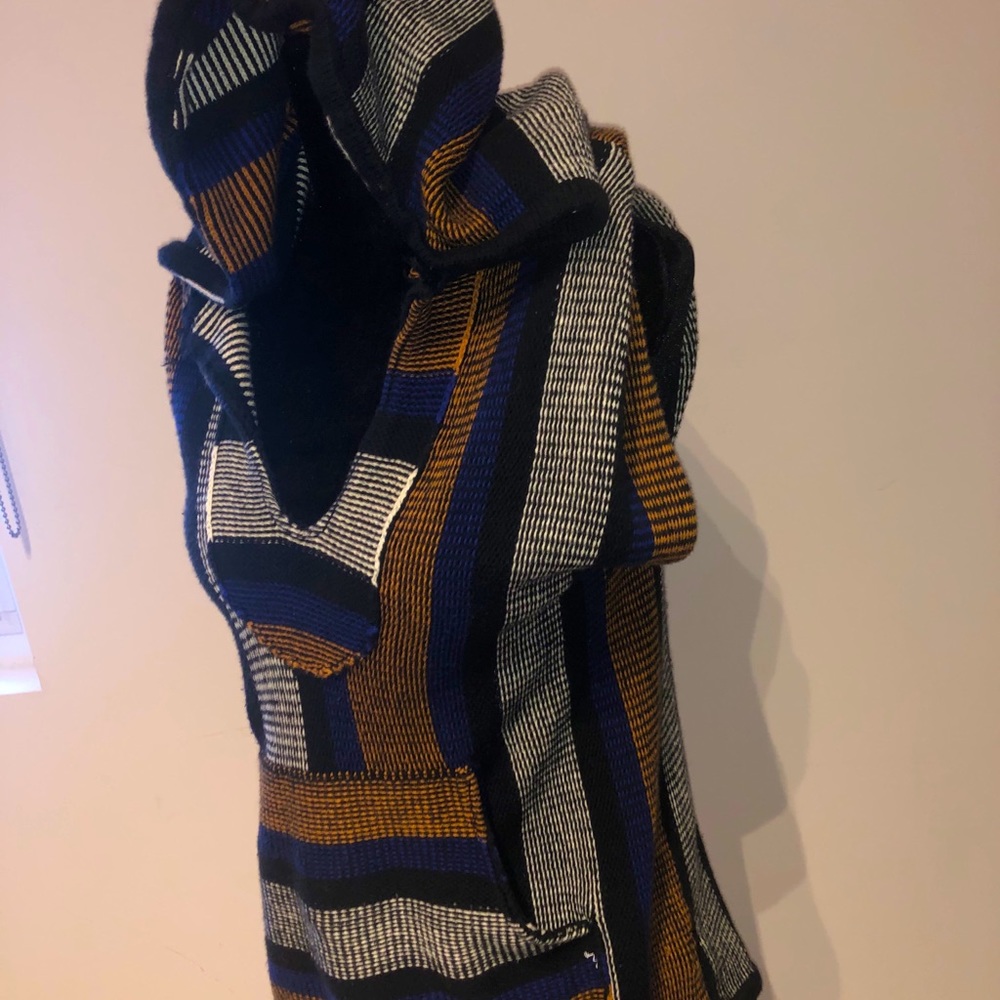 Woman’s uniquely designed poncho shrug. Size small